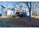 Exterior of home featuring a spacious backyard with a large deck and patio area at 3100 Benton Cir, Raleigh, NC 27615