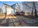 Home's backyard with landscaping and a charming decorative bridge, blending nature and design at 3100 Benton Cir, Raleigh, NC 27615