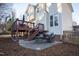 Backyard view with wooden deck, stairs, and a patio with stylish outdoor furniture and landscaping at 3100 Benton Cir, Raleigh, NC 27615