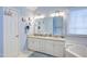 Double vanity with granite countertops and a bathtub situated next to the vanity at 3100 Benton Cir, Raleigh, NC 27615