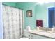 Bathroom featuring a shower with a floral shower curtain and a vanity with granite countertops at 3100 Benton Cir, Raleigh, NC 27615