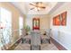 Elegant dining room featuring a tray ceiling, decorative chairs, and ample natural light at 3100 Benton Cir, Raleigh, NC 27615