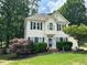 Charming two-story home with lush landscaping and a welcoming front entrance at 3100 Benton Cir, Raleigh, NC 27615