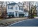 Charming two-story home featuring blue shutters, manicured landscaping, and a welcoming front entrance at 3100 Benton Cir, Raleigh, NC 27615