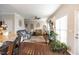 Cozy living room with hardwood floors, fireplace, and ample natural light at 3100 Benton Cir, Raleigh, NC 27615