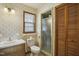 Bathroom showcasing a single sink vanity, toilet, and a walk-in shower with window at 3121 Blue Hill Ln, Durham, NC 27703