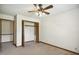 Bedroom featuring a ceiling fan, closet, neutral paint, and carpeted flooring at 3121 Blue Hill Ln, Durham, NC 27703