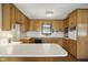 Traditional kitchen featuring wood cabinetry, laminate countertops and recessed lighting at 3121 Blue Hill Ln, Durham, NC 27703