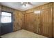 Mud room with wood paneling featuring a doorway, closet and access to an outside entrance at 3121 Blue Hill Ln, Durham, NC 27703