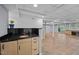 Finished basement featuring tile floor, a wet bar and access to an outdoor space at 33 Stoneridge Cir, Durham, NC 27705