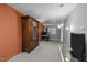Finished basement bedroom featuring neutral carpet, and an orange accent wall at 33 Stoneridge Cir, Durham, NC 27705