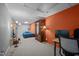 Finished basement bedroom featuring neutral carpet, and an orange accent wall at 33 Stoneridge Cir, Durham, NC 27705