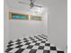 Unique bonus room with hardwood floors and contrasting black and white flooring at 33 Stoneridge Cir, Durham, NC 27705