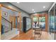 Bright dining area featuring hardwood floors and access to a private patio, ideal for entertaining at 33 Stoneridge Cir, Durham, NC 27705