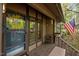 Charming covered front porch of home with a decorated door and an American flag at 33 Stoneridge Cir, Durham, NC 27705
