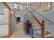 Hallway with staircase, wood floors, and views into adjacent living room with fireplace at 33 Stoneridge Cir, Durham, NC 27705