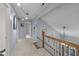 Upstairs hallway featuring neutral carpet, light blue walls, and access to various rooms at 33 Stoneridge Cir, Durham, NC 27705