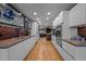 Sleek, modern kitchen featuring stainless steel appliances, custom cabinets, and a stylish backsplash at 33 Stoneridge Cir, Durham, NC 27705