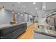 Contemporary kitchen with granite counters, island cooktop, stainless appliances, and modern lighting at 33 Stoneridge Cir, Durham, NC 27705