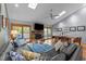 Living room with a stone fireplace, comfortable seating, access to the outside, and skylights at 33 Stoneridge Cir, Durham, NC 27705