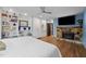 Bedroom with a stone fireplace, built-in shelves, and wood floors at 33 Stoneridge Cir, Durham, NC 27705