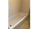 An empty bathtub awaits its next occupant in this bathroom at 335 Ashley Ave, Timberlake, NC 27583