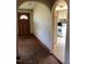 An arched entryway and a doorway with glass lead to the kitchen at 335 Ashley Ave, Timberlake, NC 27583