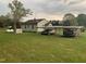Home exterior showcasing the back of the house and covered parking at 335 Ashley Ave, Timberlake, NC 27583