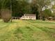 Quaint single Gathering home with covered parking and well-maintained lawn and natural surroundings at 335 Ashley Ave, Timberlake, NC 27583