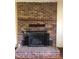Cozy brick fireplace with mantle at 335 Ashley Ave, Timberlake, NC 27583