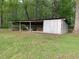 Outbuilding with covered area and storage at 335 Ashley Ave, Timberlake, NC 27583