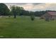 Large front yard with view of the street and neighborhood at 335 Ashley Ave, Timberlake, NC 27583