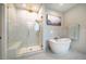 Modern bathroom featuring a large walk-in shower and freestanding tub at 353 Murray Grey Ln, Wake Forest, NC 27587