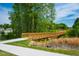 Picturesque wooden bridge in a serene community setting, perfect for leisurely strolls and enjoying nature at 353 Murray Grey Ln, Wake Forest, NC 27587