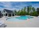 Community pool with lounge chairs, tables, and an adjacent recreation center under a blue sky at 353 Murray Grey Ln, Wake Forest, NC 27587