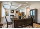 Open-concept dining area with wood table, coffered ceilings, and seamless transition to the living room at 353 Murray Grey Ln, Wake Forest, NC 27587