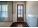 Open entryway with a wood-framed glass front door and wainscotting at 353 Murray Grey Ln, Wake Forest, NC 27587
