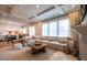 Spacious living room featuring a large sectional sofa and coffered ceilings at 353 Murray Grey Ln, Wake Forest, NC 27587