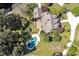 Stunning aerial view of the house with a beautiful backyard and an inviting blue swimming pool at 40 Farrells Creek Rd, Apex, NC 27523