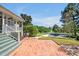 Spacious backyard featuring a brick patio and a charming view of a refreshing swimming pool at 40 Farrells Creek Rd, Apex, NC 27523