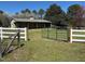 Horse barn surrounded by fencing and pastures in a rural setting at 40 Farrells Creek Rd, Apex, NC 27523