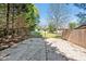 Outdoor concrete basketball court with hoop surrounded by trees in a residential area at 40 Farrells Creek Rd, Apex, NC 27523