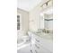Bright bathroom featuring a white vanity with a marble countertop and a shower reflected in the mirror at 40 Farrells Creek Rd, Apex, NC 27523