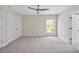 Bright bedroom with a closet, natural light, and neutral carpet at 40 Farrells Creek Rd, Apex, NC 27523