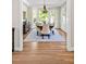 Spacious dining room featuring a chandelier, bay window, hardwood floors, and a decorative rug at 40 Farrells Creek Rd, Apex, NC 27523