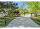 Gated driveway leading to a private estate, surrounded by lush greenery and mature trees at 40 Farrells Creek Rd, Apex, NC 27523