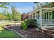 Beautifully landscaped front yard showcasing a well-maintained lawn and a charming, inviting porch at 40 Farrells Creek Rd, Apex, NC 27523