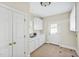 A laundry room features white cabinetry, sink, and access door at 40 Farrells Creek Rd, Apex, NC 27523