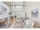 Bright living room with a stone fireplace and hardwood floors at 40 Farrells Creek Rd, Apex, NC 27523