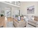 Bright living room with a stone fireplace and hardwood floors at 40 Farrells Creek Rd, Apex, NC 27523